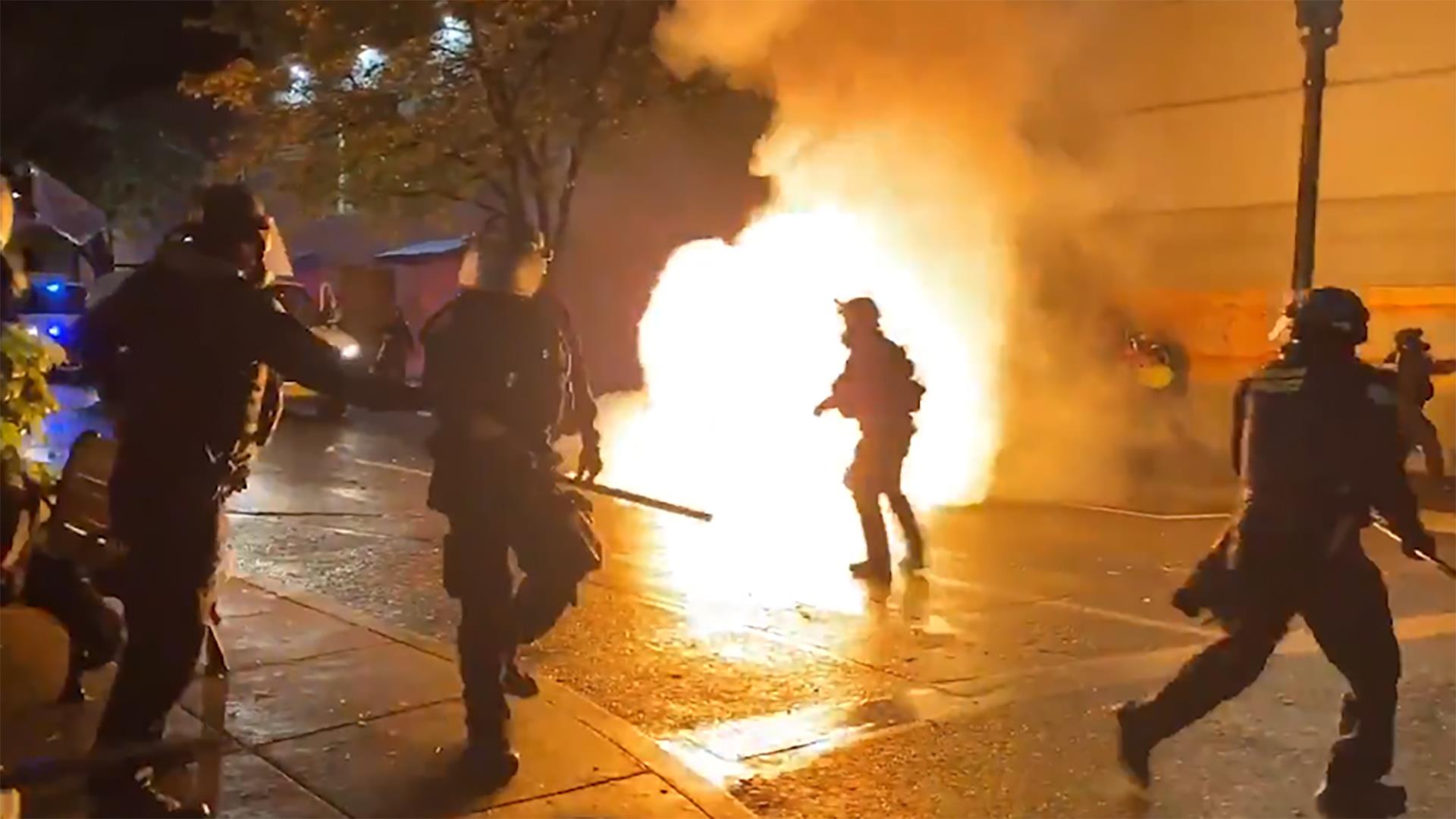 Watch: Molotov cocktails are thrown at police officers in Portland protests
